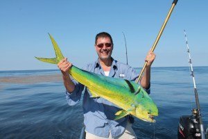 angler with mahi mahi